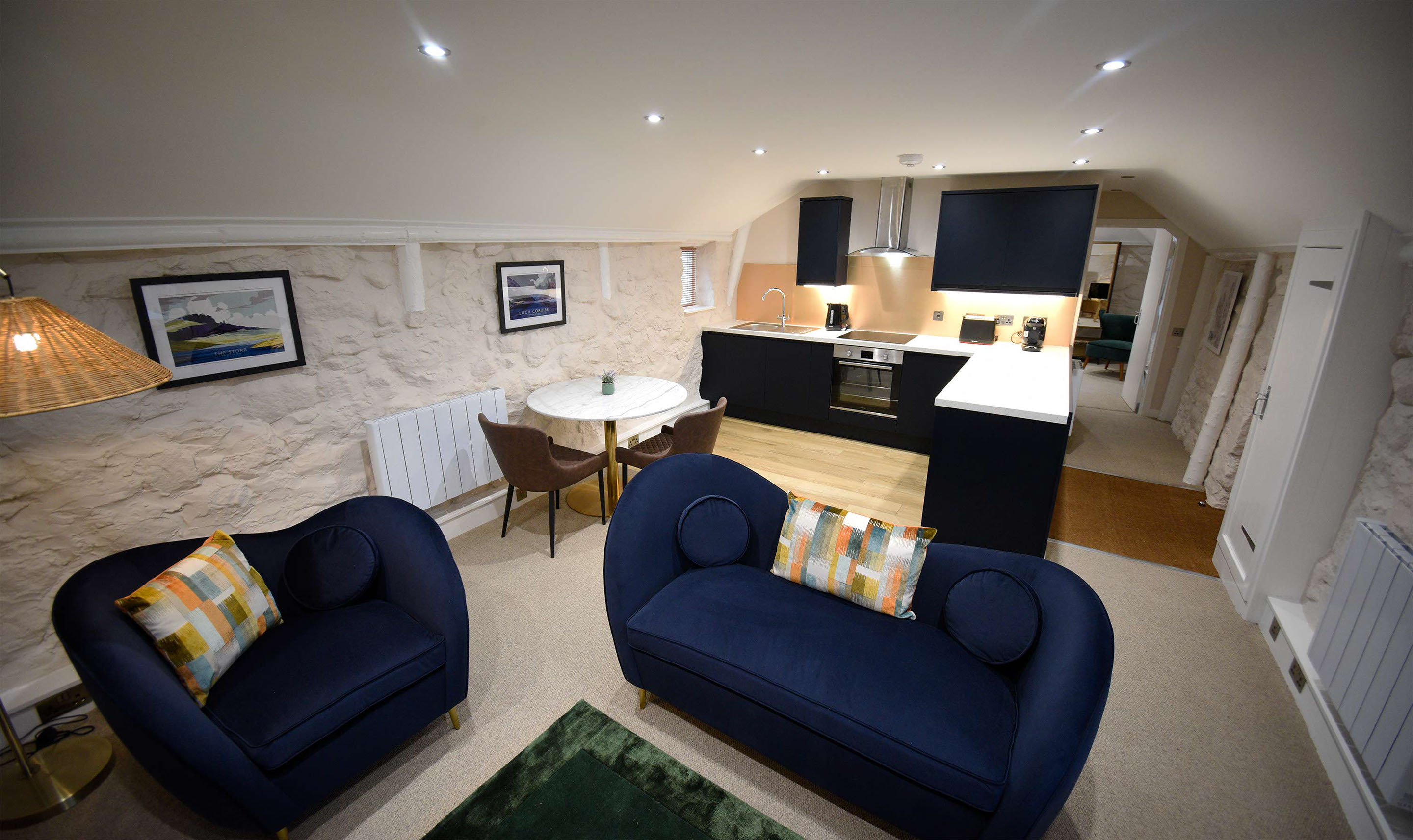 Katie Ann's Thatched Cottage contains open plan kitchen living room with sea and mountain views